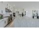 Bright white kitchen with marble countertops and stainless steel appliances at 11045 N Hershey St, Surprise, AZ 85388