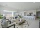Open concept living room with kitchen and dining area at 11045 N Hershey St, Surprise, AZ 85388