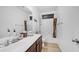 Bathroom featuring a white vanity, patterned shower curtain, and tiled flooring at 11742 W Chase Ln, Avondale, AZ 85323