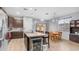 Open-concept kitchen and dining area with modern appliances, stylish bar seating and a breakfast nook at 11742 W Chase Ln, Avondale, AZ 85323