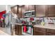 Close up of modern kitchen with stainless steel appliances and ample counter space at 11742 W Chase Ln, Avondale, AZ 85323