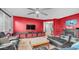 Inviting living room features sleek furniture, a mounted TV, and a cozy fireplace at 11742 W Chase Ln, Avondale, AZ 85323