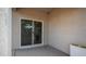A cozy patio area with a sliding glass door, perfect for outdoor relaxation and entertaining guests at 11742 W Chase Ln, Avondale, AZ 85323