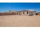 Backyard exterior view showcasing ample space and well-kept surroundings at 12381 W Marguerite Ave, Avondale, AZ 85323