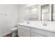 Bathroom featuring dual sinks, a large mirror, and tile flooring at 12381 W Marguerite Ave, Avondale, AZ 85323