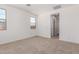 An inviting carpeted bedroom with natural light from two windows at 12381 W Marguerite Ave, Avondale, AZ 85323