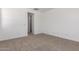 Cozy carpeted bedroom with white walls and ample natural light at 12381 W Marguerite Ave, Avondale, AZ 85323