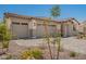 Exterior showcasing well-manicured landscaping and a three-car garage at 12381 W Marguerite Ave, Avondale, AZ 85323
