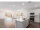 Open concept kitchen and living room offers stainless appliances and lots of natural light at 12381 W Marguerite Ave, Avondale, AZ 85323