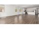 Spacious living room with an open floor plan, wood-look tile, and lots of windows at 12381 W Marguerite Ave, Avondale, AZ 85323