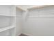 Functional walk-in closet with white shelving and hanging rods at 12381 W Marguerite Ave, Avondale, AZ 85323