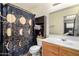 The bathroom features a single sink vanity and tiled floors at 12606 W Scotts Dr, El Mirage, AZ 85335