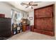 Versatile room with Murphy bed, providing a flexible living space and includes a window with outside view at 12606 W Scotts Dr, El Mirage, AZ 85335