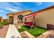 Charming home featuring a cozy front yard with a swing for relaxing at 12606 W Scotts Dr, El Mirage, AZ 85335