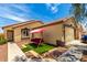 Charming home featuring a cozy front yard with a swing for relaxing at 12606 W Scotts Dr, El Mirage, AZ 85335
