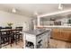 The kitchen features wooden cabinetry, stainless steel appliances, and an open floorplan at 12606 W Scotts Dr, El Mirage, AZ 85335