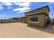 Expansive backyard features a covered patio with views of adjacent homes at 12816 N 172Nd Dr, Surprise, AZ 85388