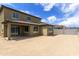 An empty backyard with a covered patio and block wall fence at 12816 N 172Nd Dr, Surprise, AZ 85388
