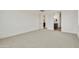 Large bedroom with neutral carpeting and easy access to the ensuite bathroom at 12816 N 172Nd Dr, Surprise, AZ 85388