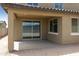 The covered patio features concrete flooring with an adjacent yard at 12816 N 172Nd Dr, Surprise, AZ 85388