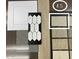 Display of interior upgrade materials including cabinets, flooring, backsplash and carpet samples at 12816 N 172Nd Dr, Surprise, AZ 85388