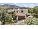 Aerial view of a house with a backyard putting green and mountain views at 13250 N 13Th Ln, Phoenix, AZ 85029