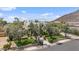 Expansive residence featuring manicured lawns, mature trees, and paved walkways at 13250 N 13Th Ln, Phoenix, AZ 85029