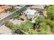 Expansive property featuring a sparkling pool, putting green, and well-manicured landscaping for outdoor enjoyment at 13250 N 13Th Ln, Phoenix, AZ 85029