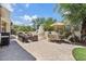 Expansive backyard with outdoor seating, putting green, and mature trees at 13250 N 13Th Ln, Phoenix, AZ 85029