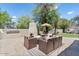 Spacious backyard featuring a built-in grill, fireplace, and putting green at 13250 N 13Th Ln, Phoenix, AZ 85029