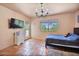 Cozy bedroom featuring tile floors, a chandelier, and a window with views at 13250 N 13Th Ln, Phoenix, AZ 85029