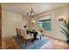 Charming dining area featuring tile floors, chandelier, large windows, and an elegant table setup at 13250 N 13Th Ln, Phoenix, AZ 85029