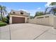 Spacious driveway leading to a two-car garage, enhanced by a secure gated area at 13250 N 13Th Ln, Phoenix, AZ 85029