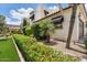 Charming home exterior with well-maintained landscaping, including vibrant red flowers at 13250 N 13Th Ln, Phoenix, AZ 85029