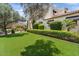 Beautiful home featuring well-manicured lawn, mature trees, and lush landscaping at 13250 N 13Th Ln, Phoenix, AZ 85029