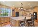 Bright, modern kitchen featuring an island with bar seating, stainless steel appliances, and custom cabinetry at 13250 N 13Th Ln, Phoenix, AZ 85029