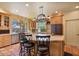 Entertain in a custom kitchen with island seating, modern appliances, a large window and pendant lighting at 13250 N 13Th Ln, Phoenix, AZ 85029