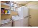 Convenient laundry room equipped with washer, dryer, and utility sink at 13250 N 13Th Ln, Phoenix, AZ 85029