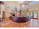 Spacious living room featuring tile floors, a cozy fireplace, and abundant natural light at 13250 N 13Th Ln, Phoenix, AZ 85029