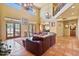 Grand living room featuring tile floors, soaring ceilings, natural light and a seamless indoor/outdoor flow at 13250 N 13Th Ln, Phoenix, AZ 85029