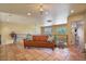 Open loft with tile flooring, a cozy orange sofa, multiple windows, and views of the surrounding area at 13250 N 13Th Ln, Phoenix, AZ 85029