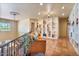 Stylish loft featuring tiled flooring, a comfortable orange sofa, and built-in shelving at 13250 N 13Th Ln, Phoenix, AZ 85029