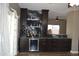 Modern bar area with wine storage, beverage cooler, and attractive lighting at 13486 W Evans Dr, Surprise, AZ 85379