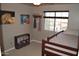 Charming bedroom with a bunk bed, horse themed artwork, and a window with natural light at 13486 W Evans Dr, Surprise, AZ 85379