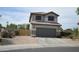 Charming two-story home featuring desert landscaping, a two car garage and a neutral color palette at 13486 W Evans Dr, Surprise, AZ 85379
