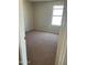 Cozy bedroom with plush carpeting and a bright window at 14150 W Boca Raton Rd, Surprise, AZ 85379