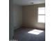 Bedroom with one window and neutral carpeting, creating a peaceful and inviting atmosphere at 14150 W Boca Raton Rd, Surprise, AZ 85379