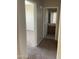 Hallway featuring doorways to the bedroom and bathroom at 14150 W Boca Raton Rd, Surprise, AZ 85379