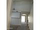 Living room with high ceilings and a large screen, flooded with natural light from sliding glass doors at 14150 W Boca Raton Rd, Surprise, AZ 85379