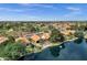 Lakefront community featuring backyards with pools and mature landscaping with lake views at 1558 W Maplewood St, Chandler, AZ 85286